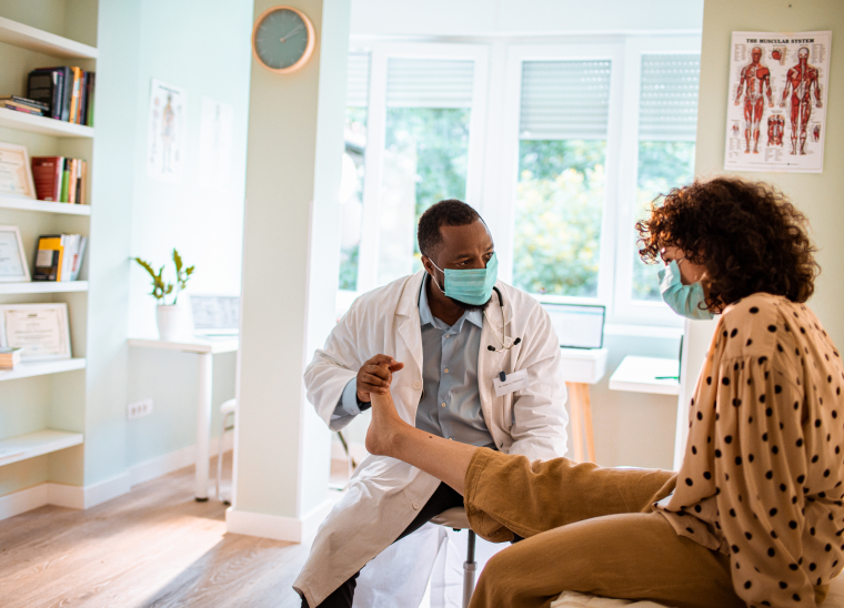 Physical therapist helping a patient